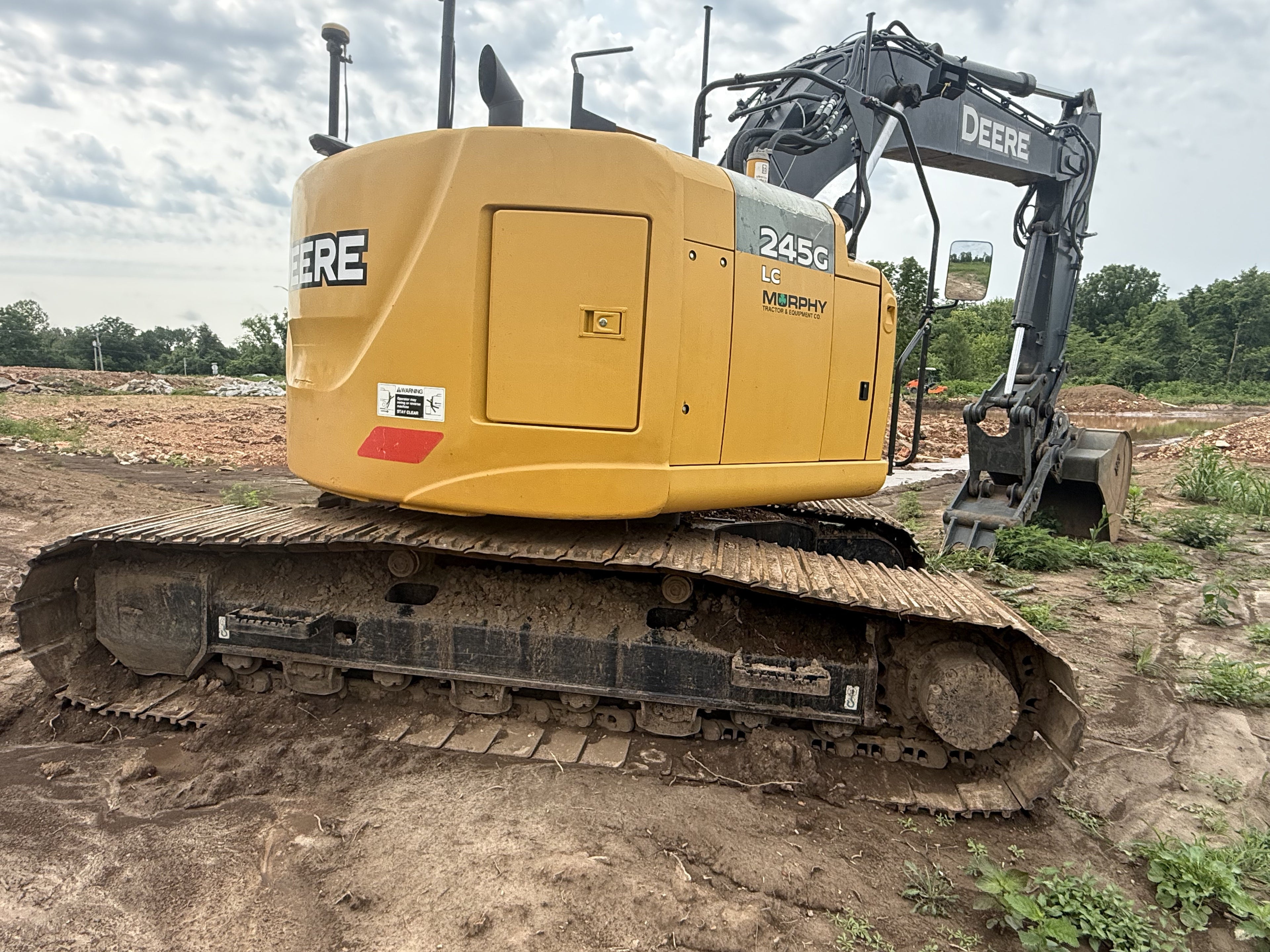 John Deere 245G LC excavator — side view and undercarriage